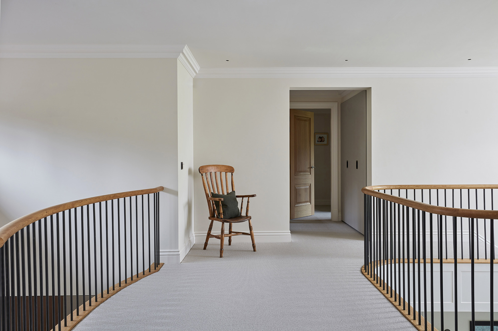 Landing with stair ballustrades and large window - New build by KM Grant Surrey